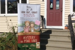 Mystery at Pine Lake event sign